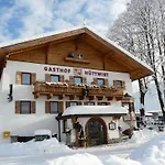 Huettwirt Maison d'hôtes Kössen